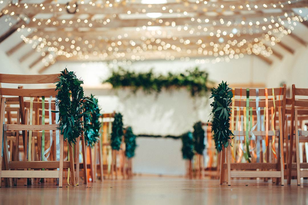 wedding venue decorated with greenery