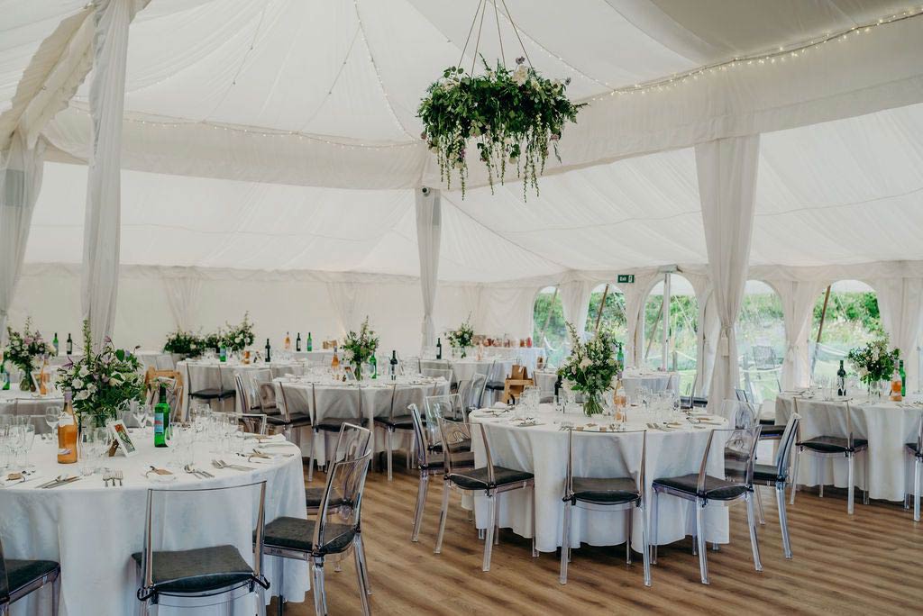 Wedding marquee decorated with flowers for reception