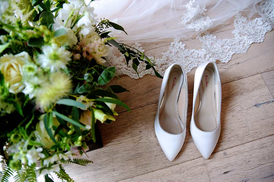 wedding bouquet with veil and wedding shoes