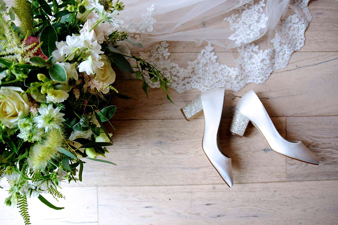 wedding bouquet with veil and wedding shoes
